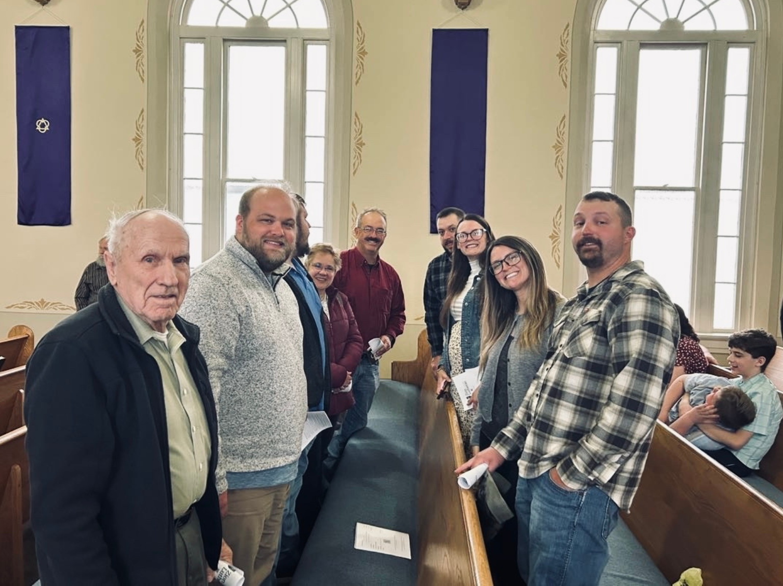 woman sitting on chair in front of table white reading book