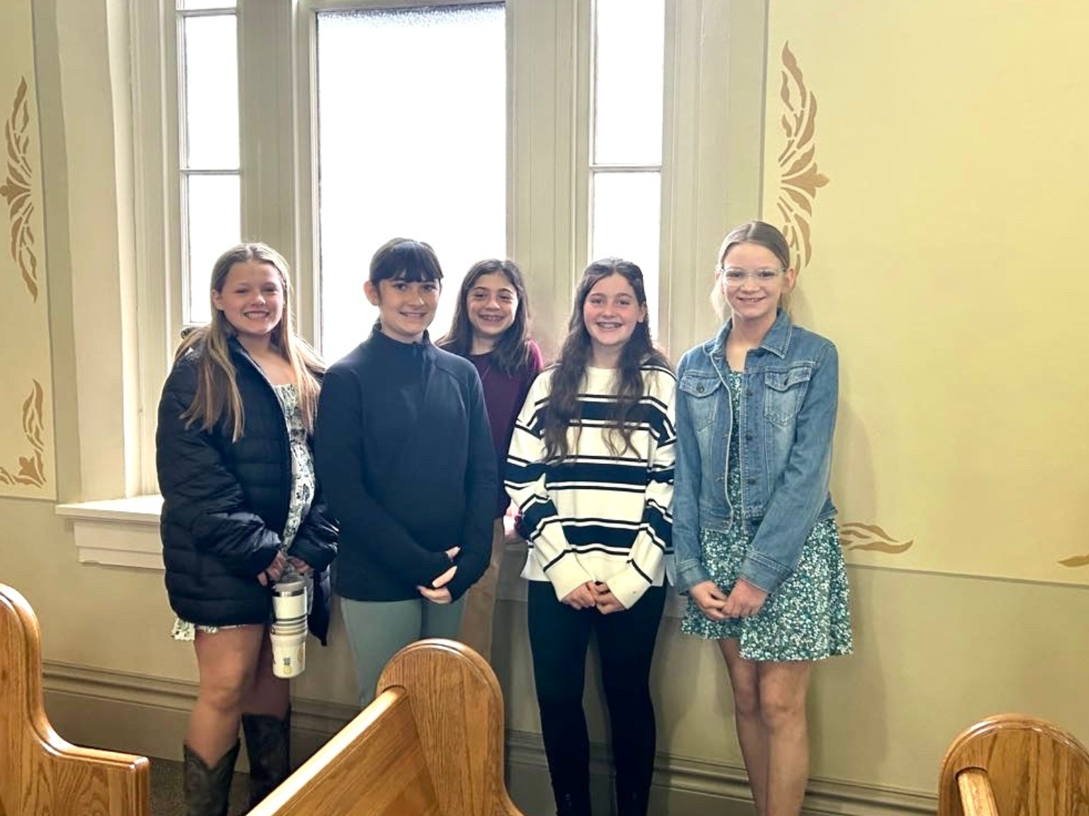 three men and laughing two women walking side by side