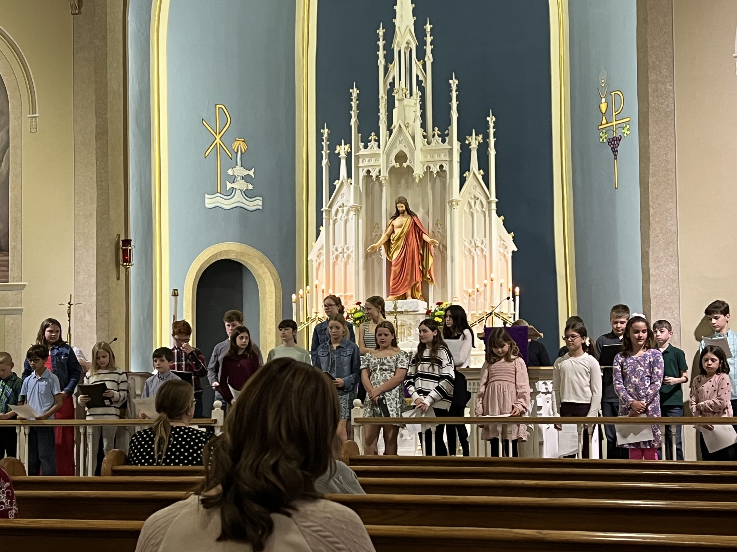 people sitting on chair in front of table while holding pens during daytime